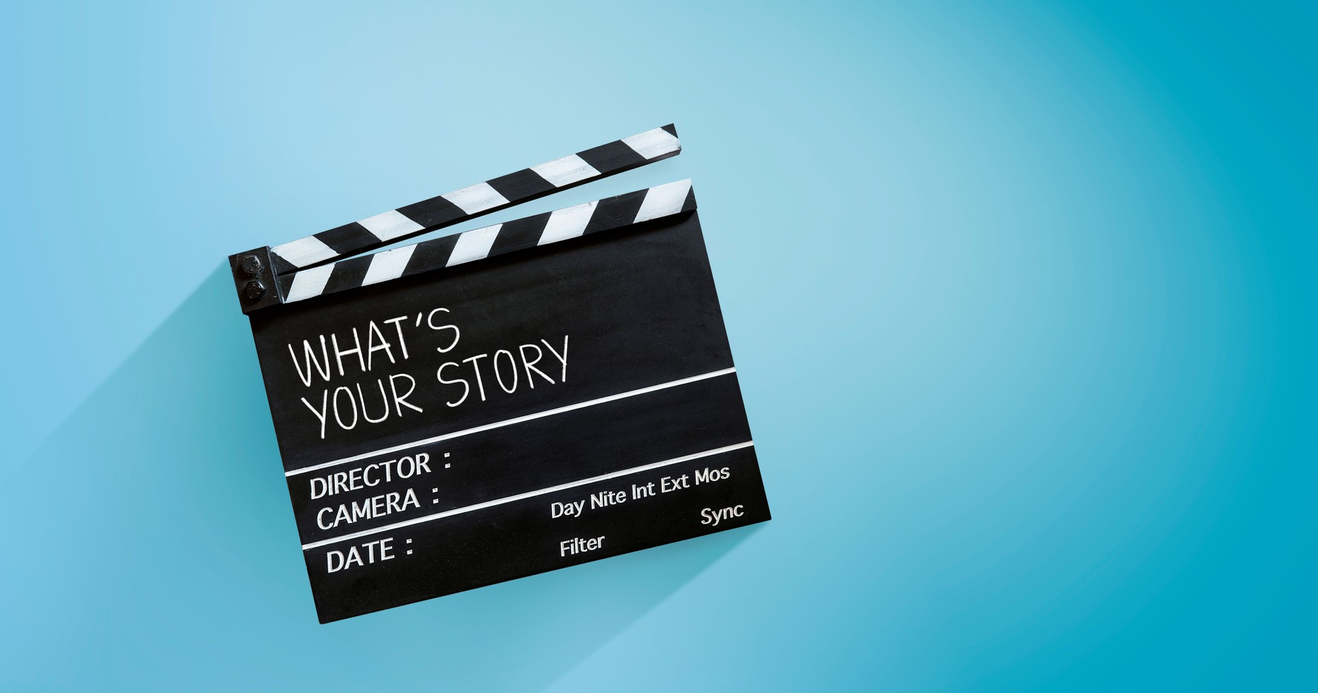 what's your story, film slate, or clapperboard on blue background.